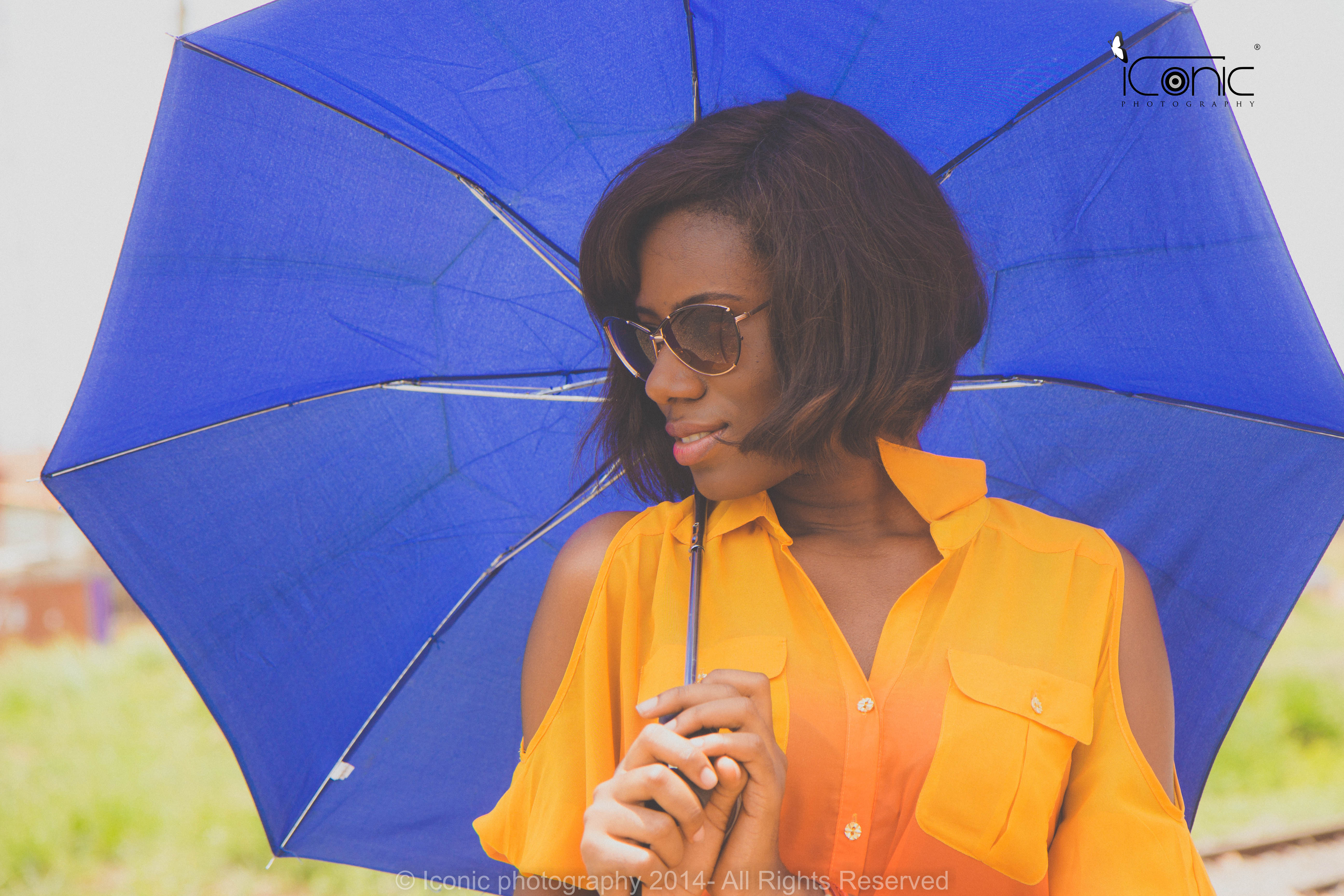 Window with sun in background, desk with book, fountain pen, and paperclips.