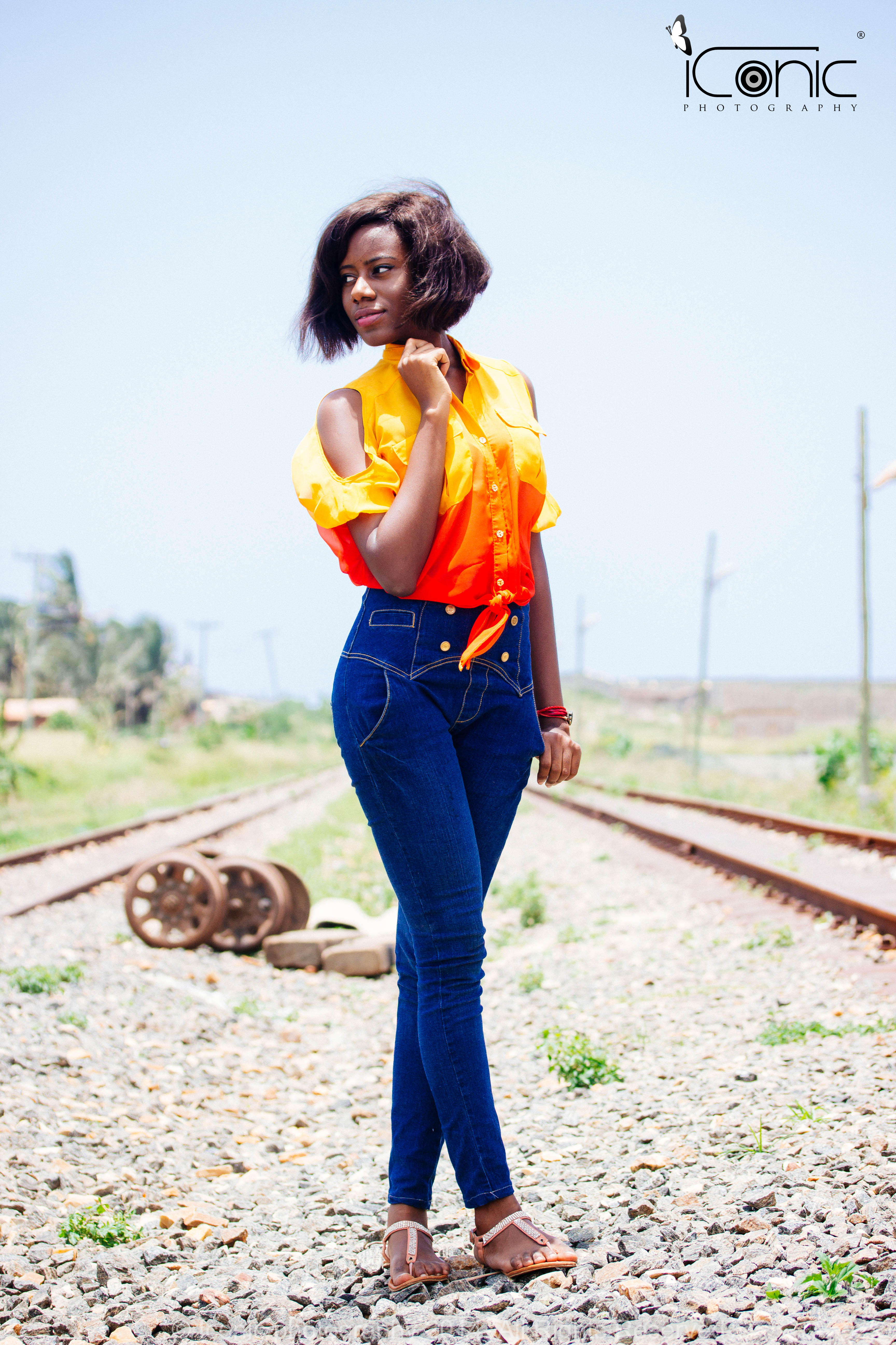 Wax seals on beige envelopes on grey tablecloth with marble dish and white bowl in background with white striped backdrop.